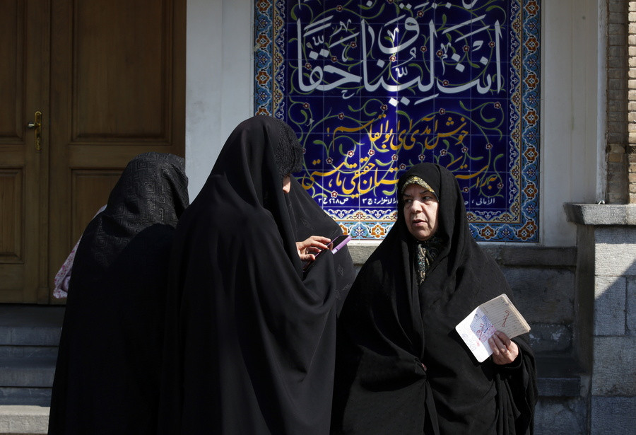 epa11190301 Veiled Iranian women wait in a line to cast their votes during the Iranian legislative election at the Abdol-Azim shrine in Shahre-Ray, southern Tehran, Iran, 01 March 2024. Iranians vote for new members of Iran's parliament, and for the Assembly of Experts, the body in charge of appointing Iran's Supreme Leader.  EPA/ABEDIN TAHERKENAREH